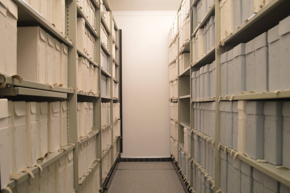 An old recorded deed with a notary seal, the kind of document kept in county property records